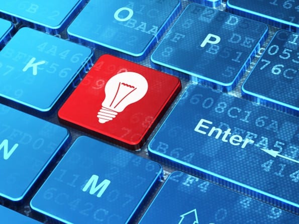 Business concept: Light Bulb on computer keyboard background